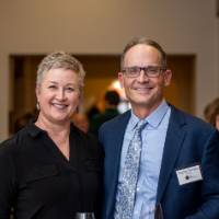 Man and woman smile for photo